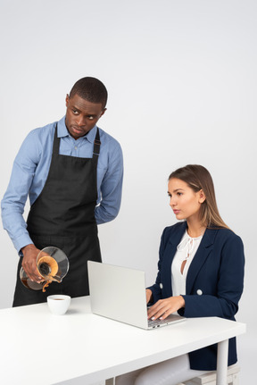 Attractive businesswoman working at cafe