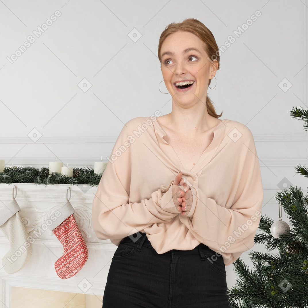 Young woman excited to get her christmas gifts