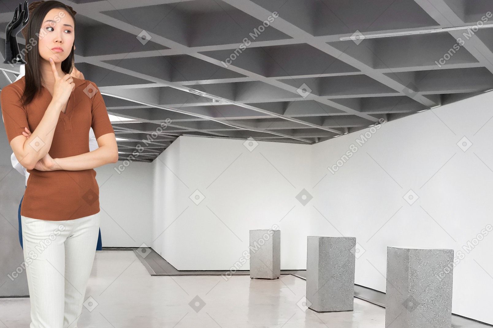 A woman standing in an empty gallery