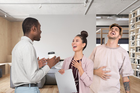 Black male telling joke to his colleagues