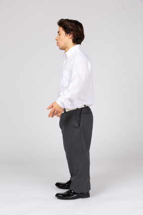 Side view of young man in white shirt