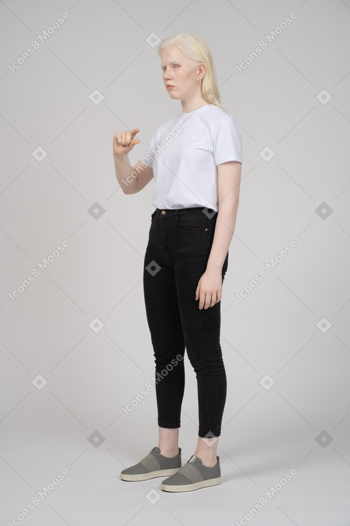 Woman showing size of something small