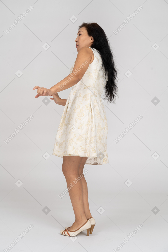 Woman in a white dress standing