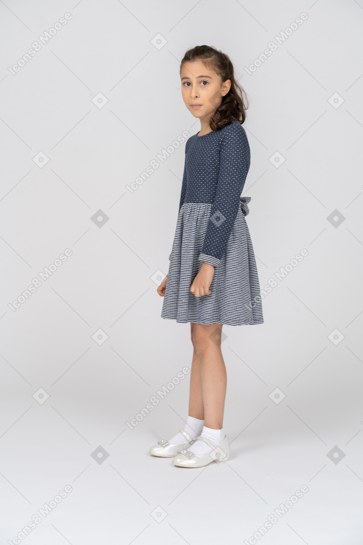 Three-quarter view of a girl looking like a deer in the headlights