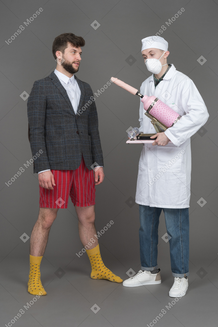 Young man looking at doctor