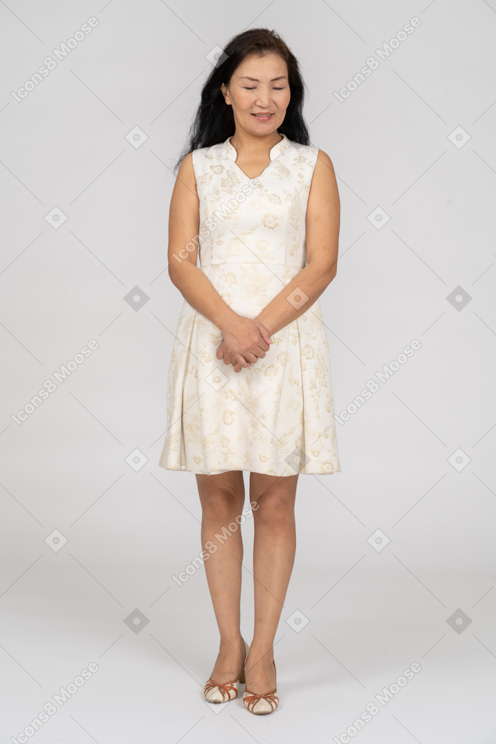 Woman in a white dress standing