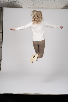 Woman in casual clothes jumping