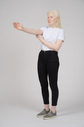 Young woman raising her arm