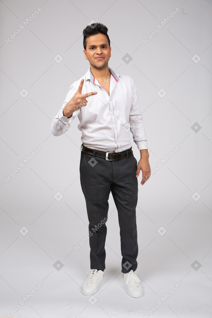 Man in white shirt standing