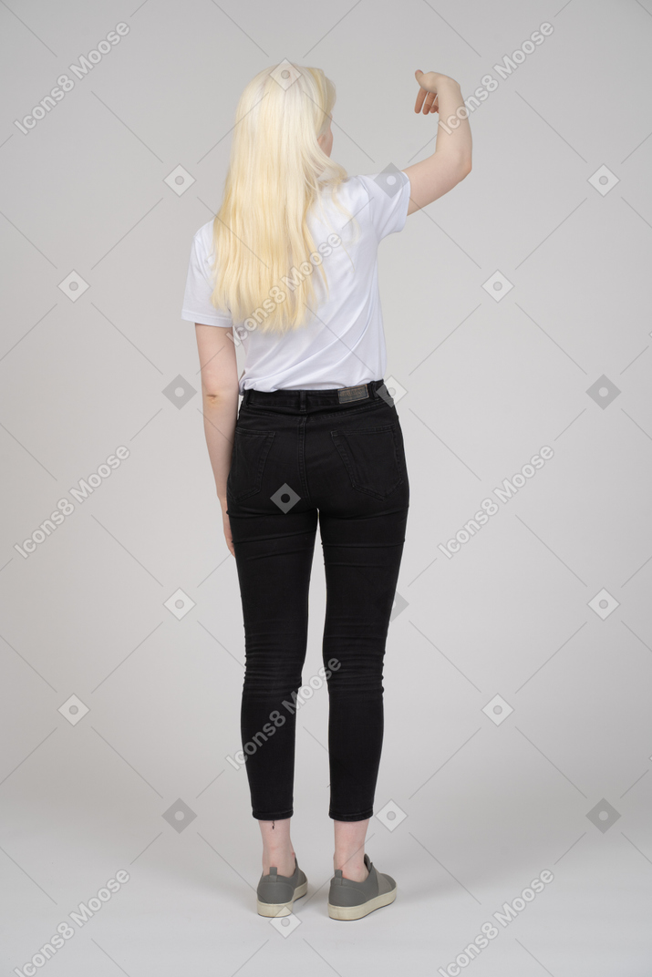 Girl standing with raised hand