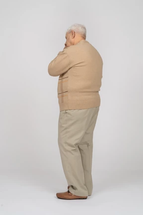 Side view of a sleepy old man in casual clothes