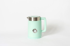 Green tea pot on white background