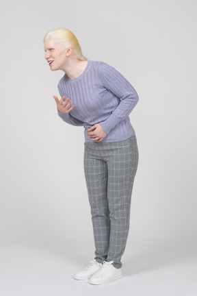 Young woman smiling and bending down