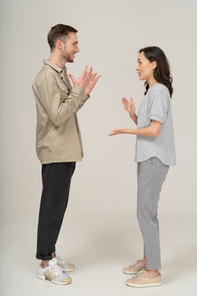 Side view of young couple speaking to each other