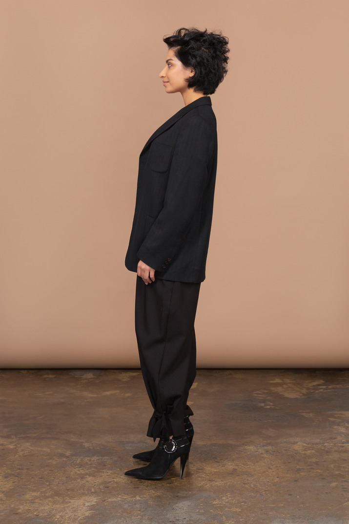Side view of a businesswoman wearing black suit
