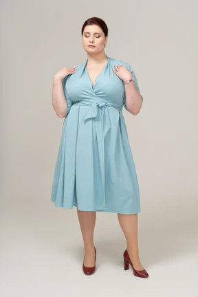 Front view of a woman in blue dress
