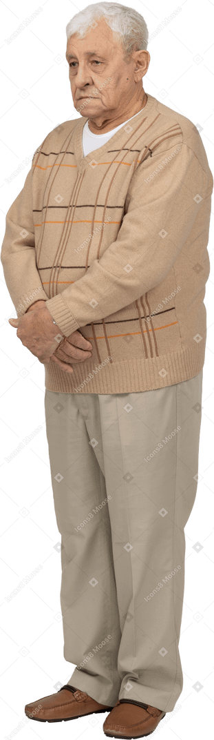 Front view of an old man in casual clothes standing still