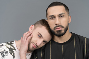 Young man putting head on partner's shoulder