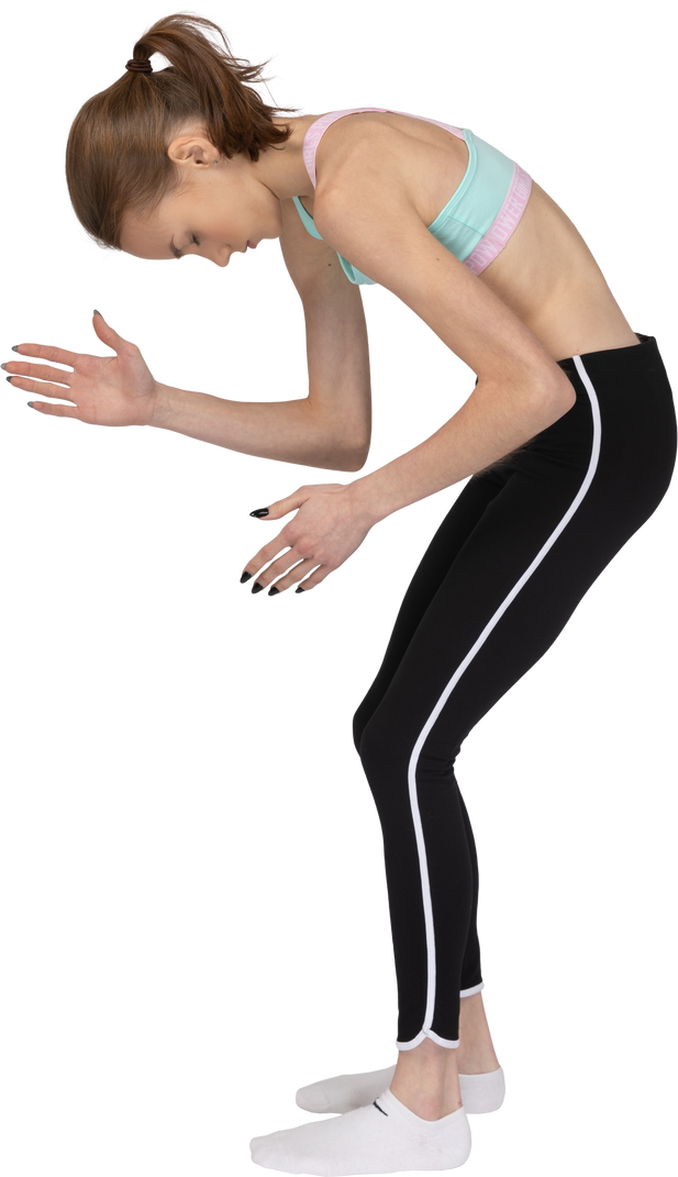 Side View Of A Teen Girl In Sportswear Bending Over And Raising Her Hands Photo