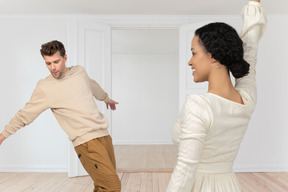 A man and a woman dancing in a room