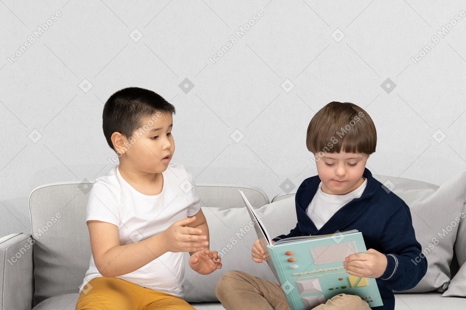 Mother and son reading a book at home
