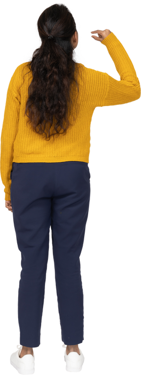 Rear view of a girl in casual clothes showing small size of something