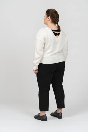 Plump woman in casual clothes standing