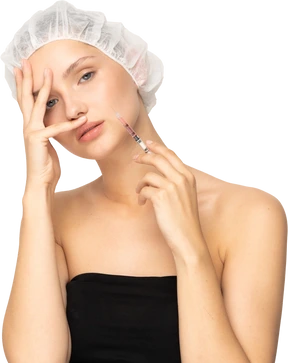 Woman with syringe looking at camera