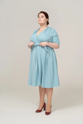 Front view of a woman in blue dress