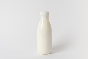 Small plastic bottle with some dairy product inside