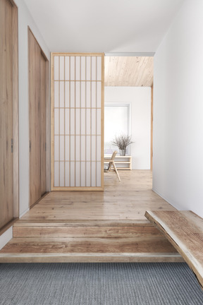 Corridor with wooden floor and a sliding door