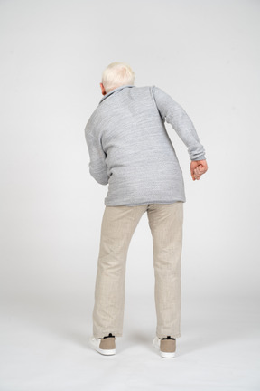 Back view of a man bending down