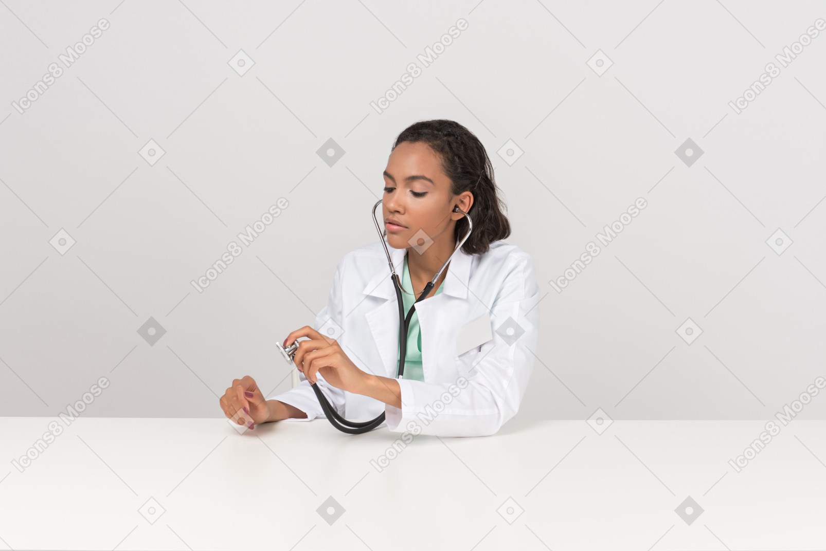 Beautiful female doctor with the stethoscope