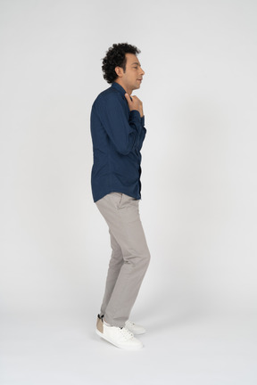 Man in casual clothes posing in profile