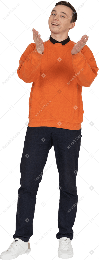 Young man in orange sweatshirt standing