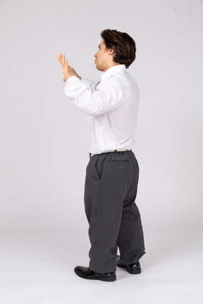 Young man showing palms