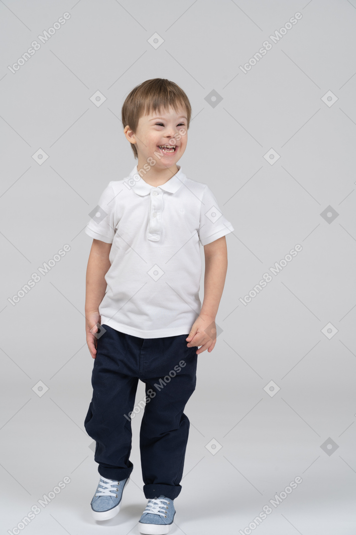 Cheerful boy walking toward the camera
