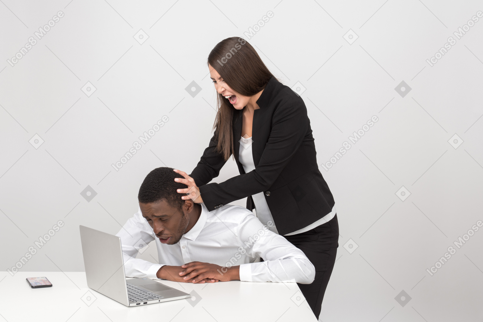 Aggressive female boss pulling her employee's head into a laptop
