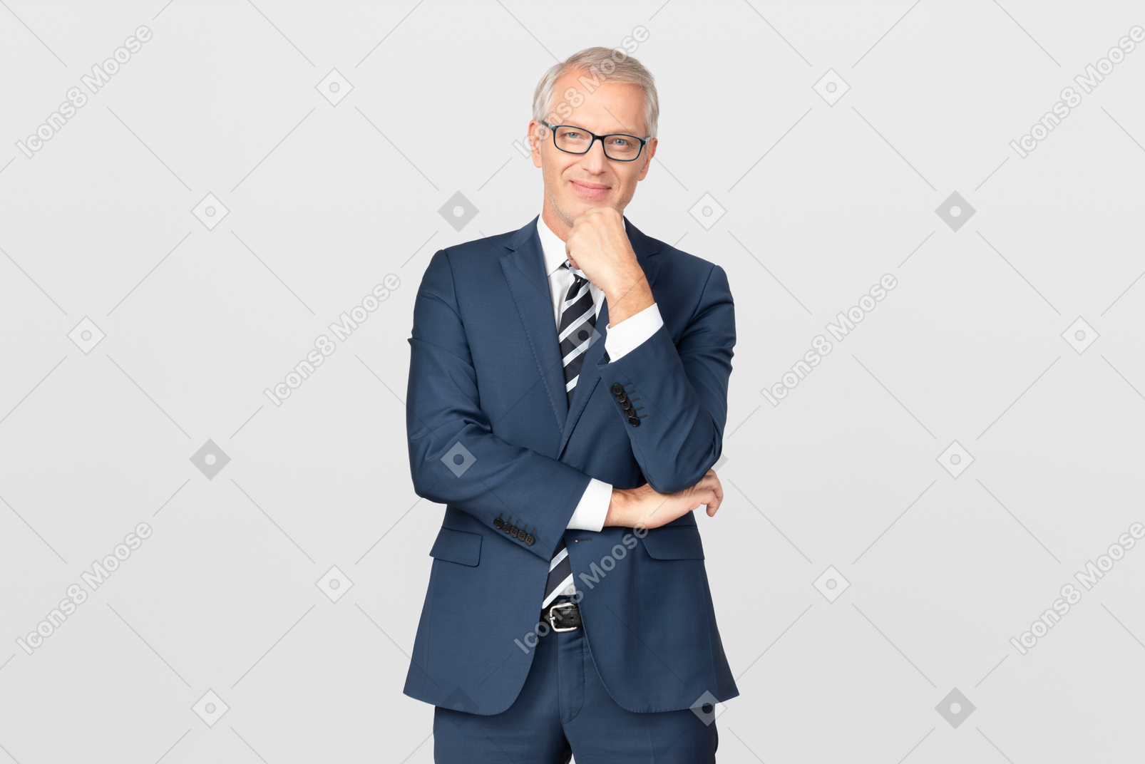 Mature businessman leaning his chin on hand