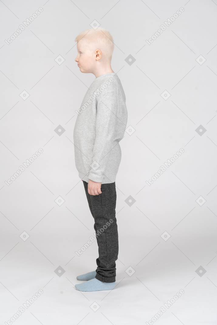 Full-length of a little boy in casual clothes teasing