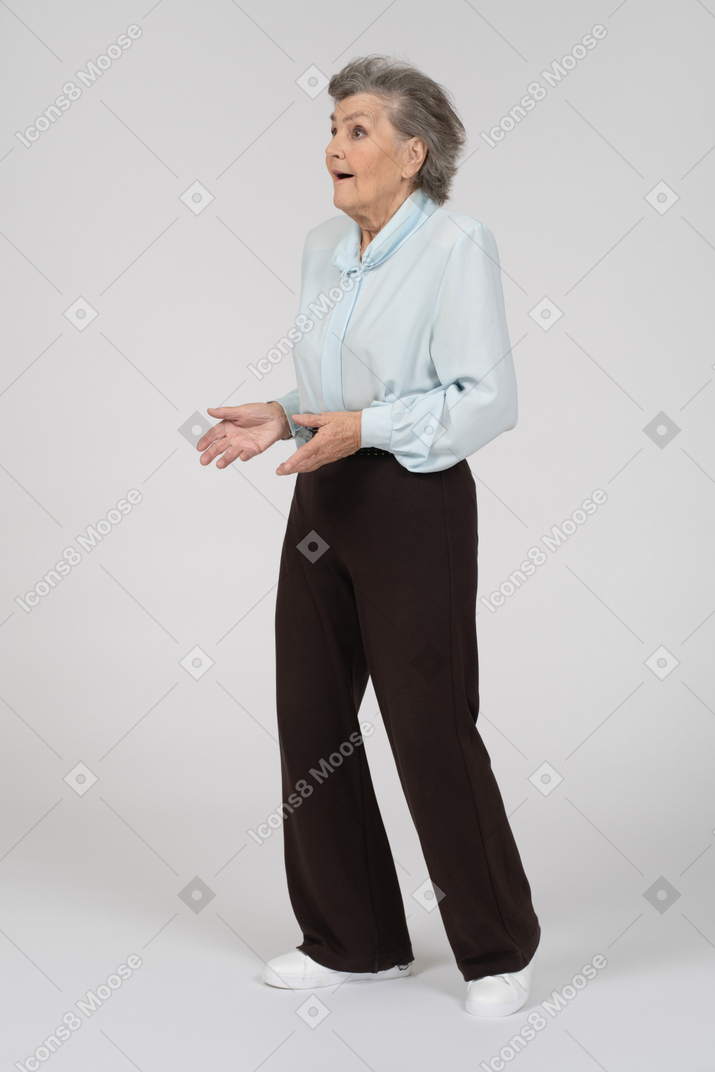 Three-quarter view of an old woman shrugging