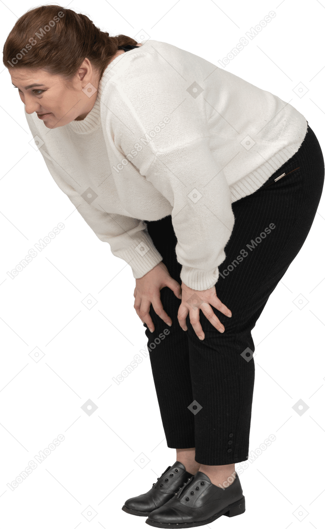 Plump woman in casual clothes touching knees