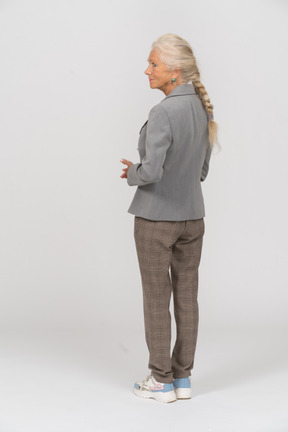 Rear view of an old lady in suit