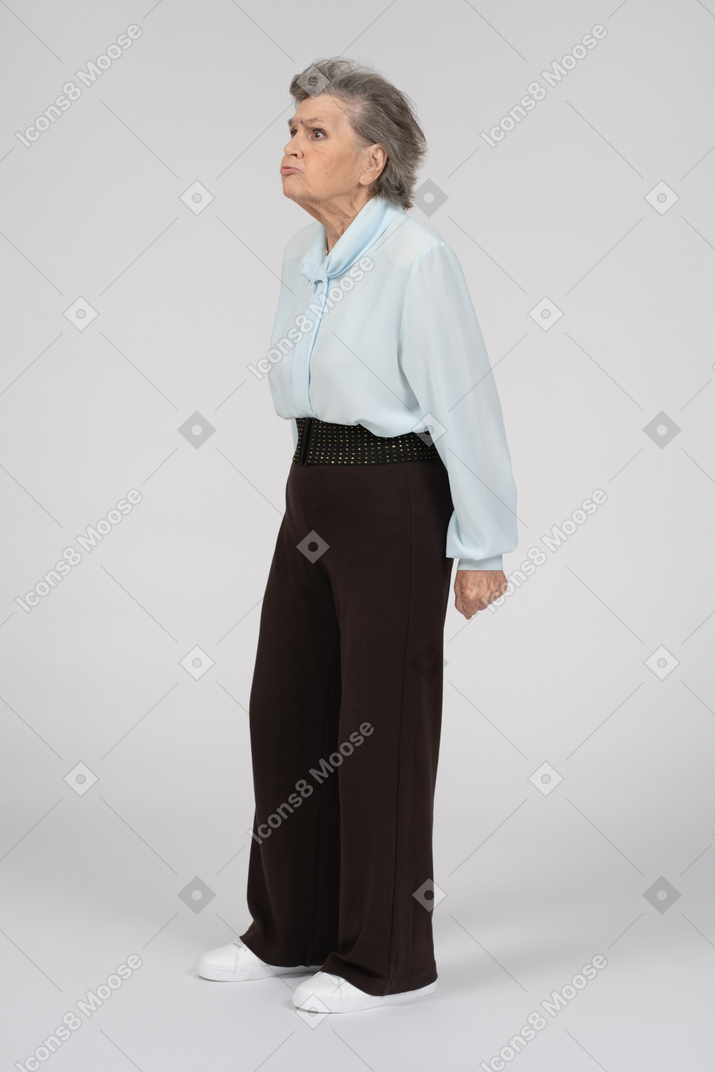 Three-quarter view of an old woman pouting intensely