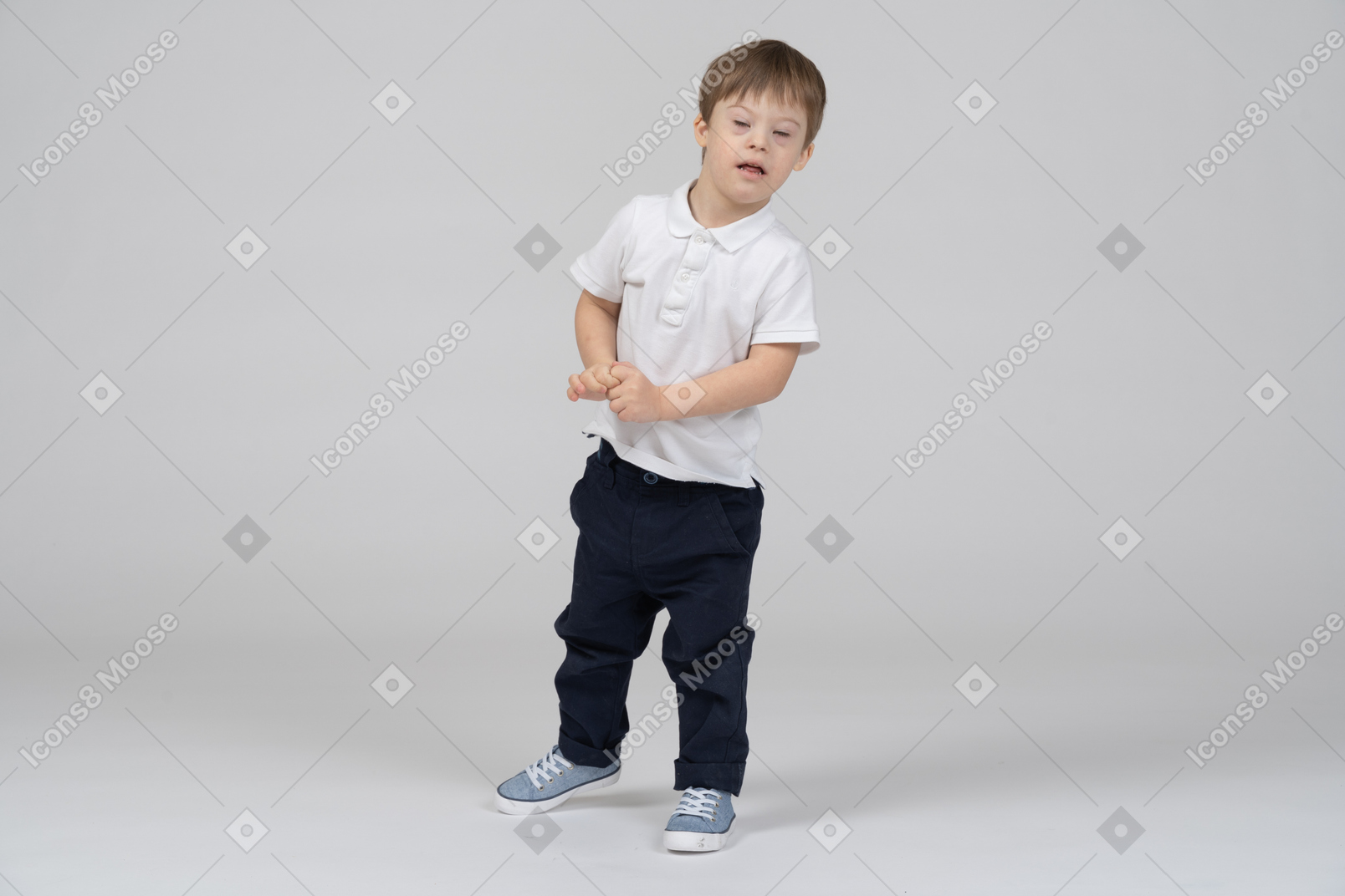 Little boy standing with his eyes closed