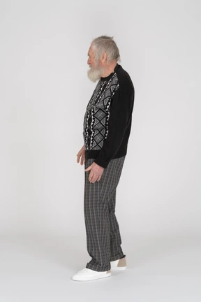 Standing elderly man turned to the left