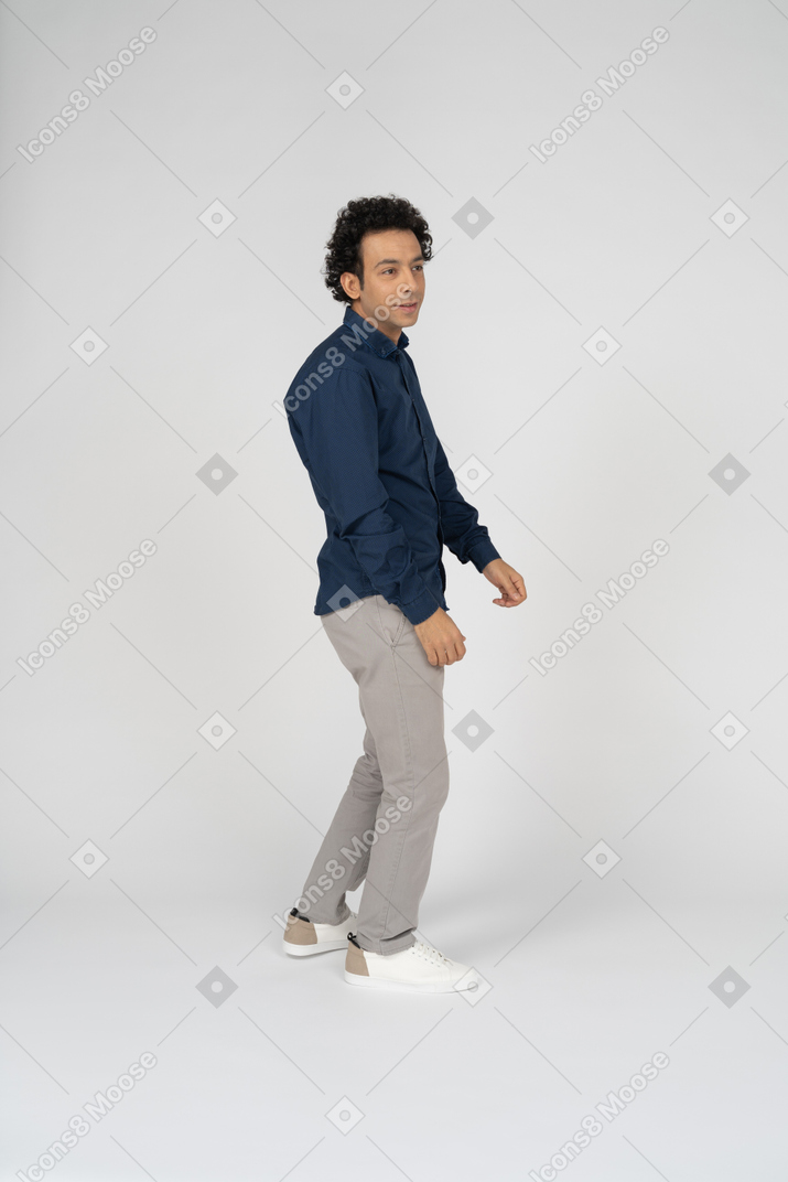 Side view of a man in casual clothes dancing