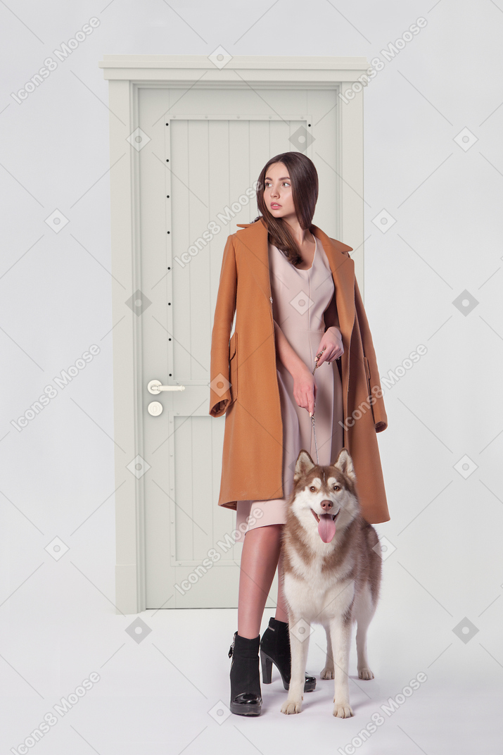 About to walk her husky dog