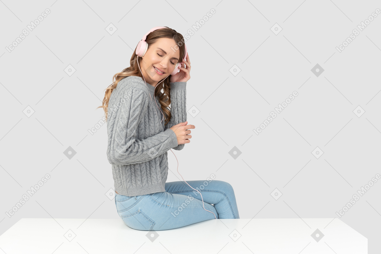 A woman standing on a couch