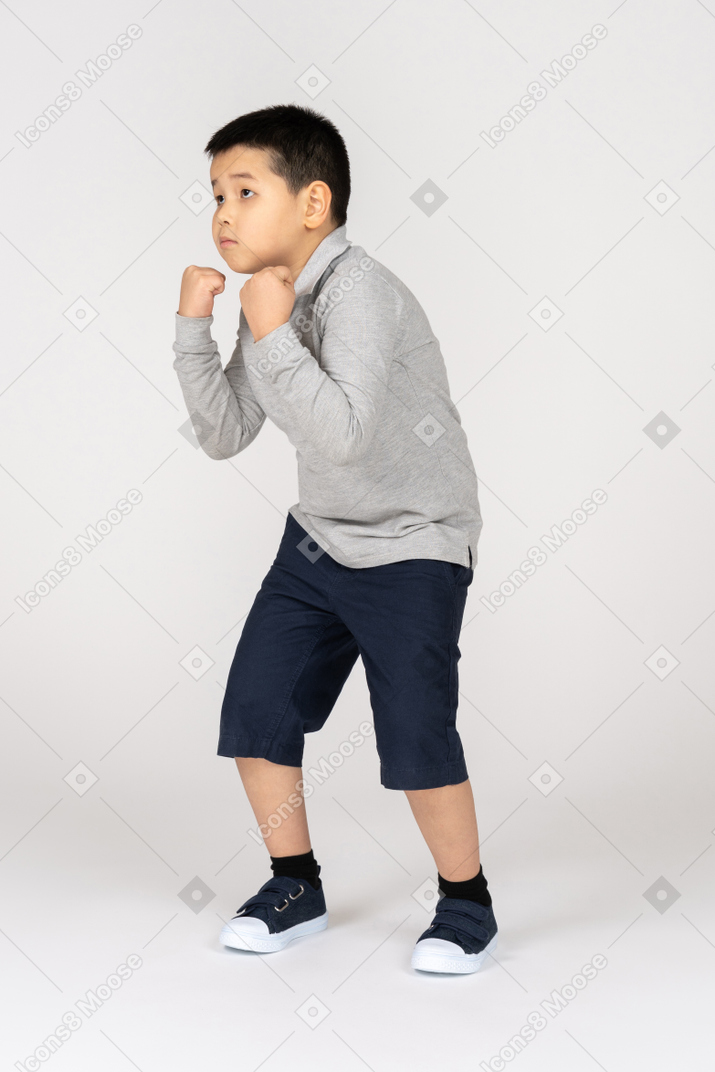 Boy in fighting position